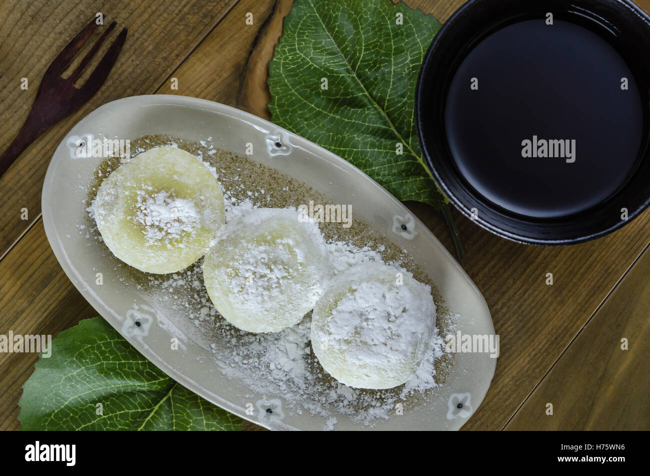 Daifuku Mochi Japanese dessert on dish over wooden background Stock Photo