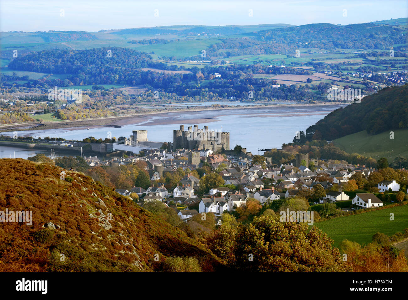 Conwy Castle, surrounded by the town, and nestled by the estuary of the River Conwy in North Wales, Great Britain. Stock Photo