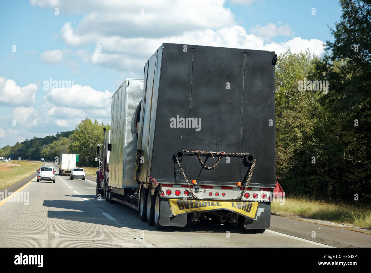 Tarp-covered freight on semi truck on highway Stock Photo