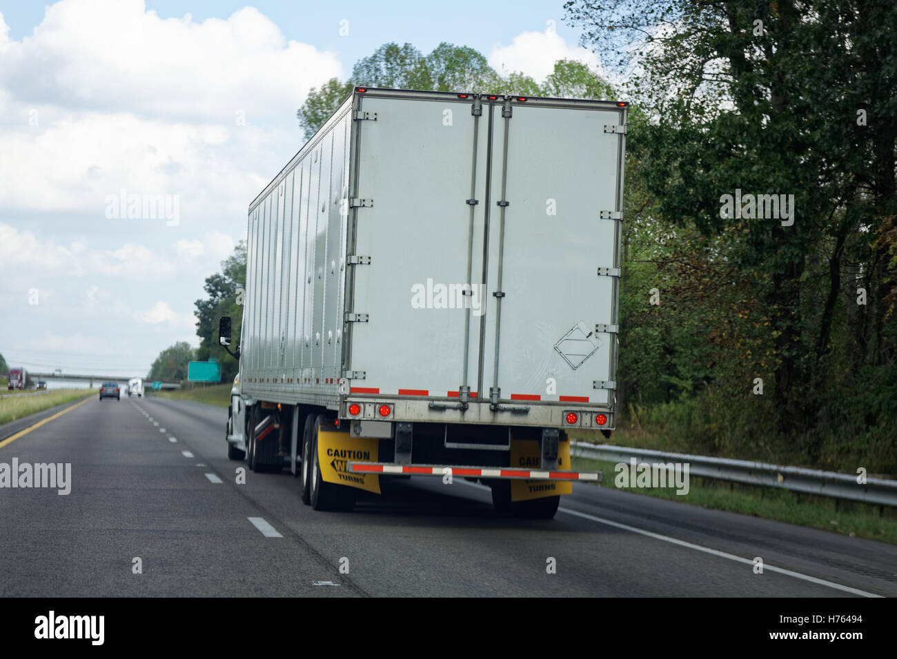 Rear view of semi truck on highway Stock Photo