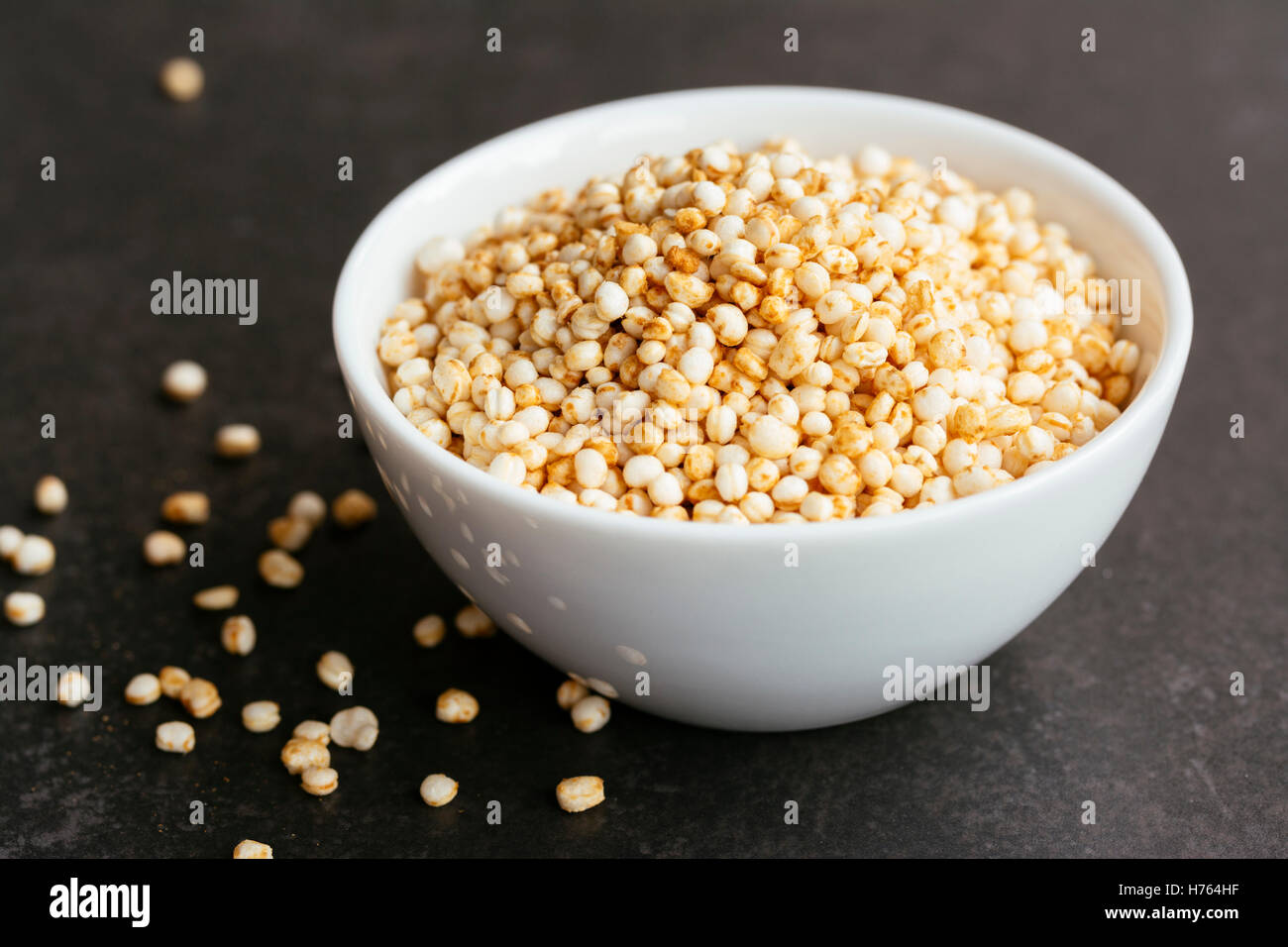 Puffed quinoa in a small bowl Stock Photo