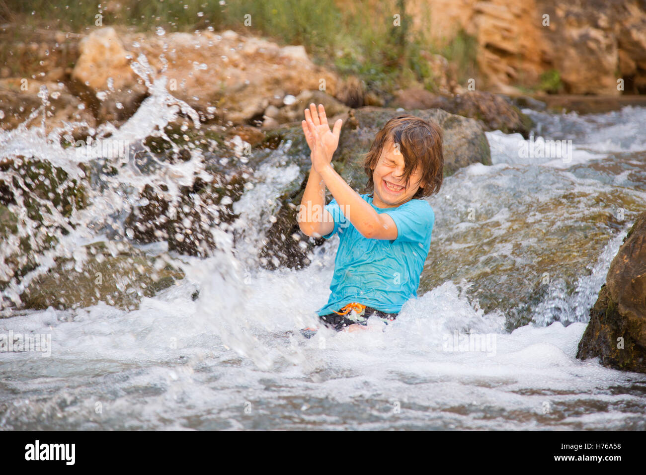 Boys splashing in river hi-res stock photography and images - Alamy