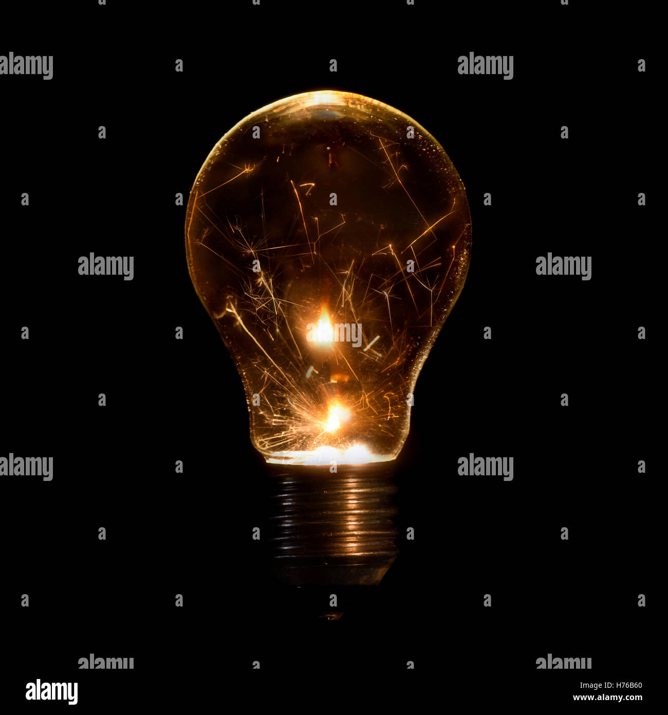 Illuminated light bulb with sparklers inside Stock Photo