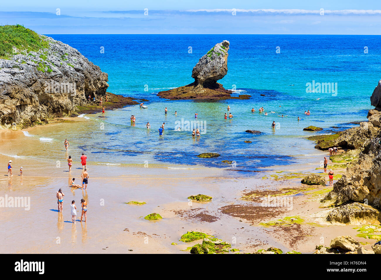 tourist-people-enjoying-in-buelna-beach-at-asturias-hi-res-stock