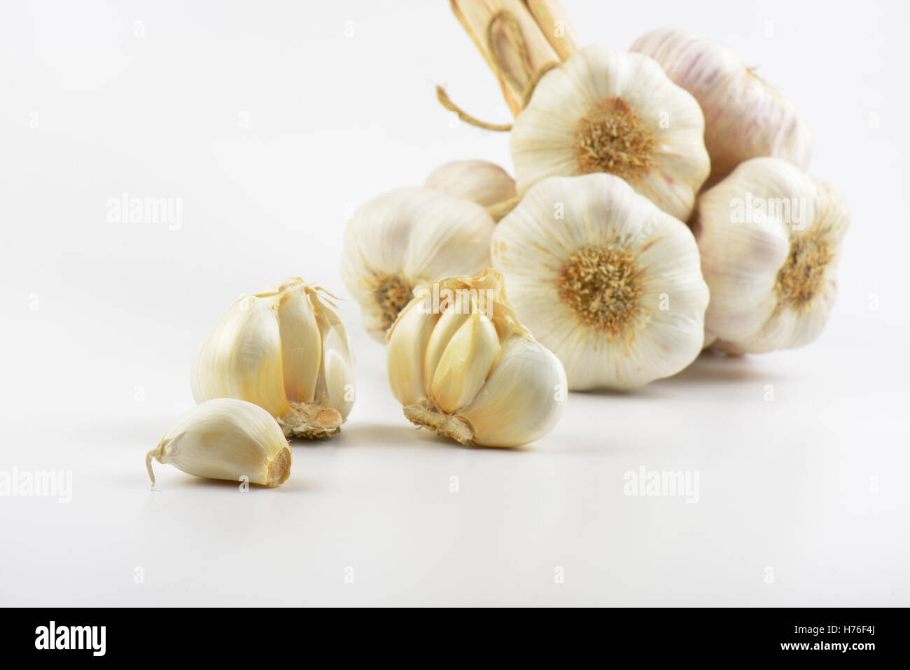 close up of garlic bulbs and cloves on white background Stock Photo - Alamy