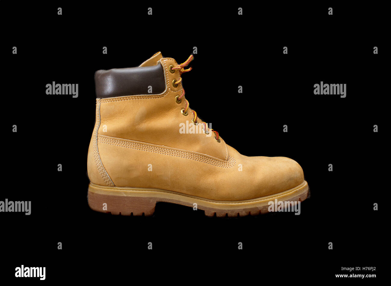 Authentic 8 inch Yellow Work Boot isolated on black Stock Photo