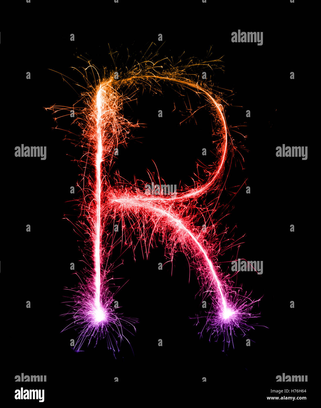 Sparkler firework light alphabet R (Capital Letters) at night background Stock Photo