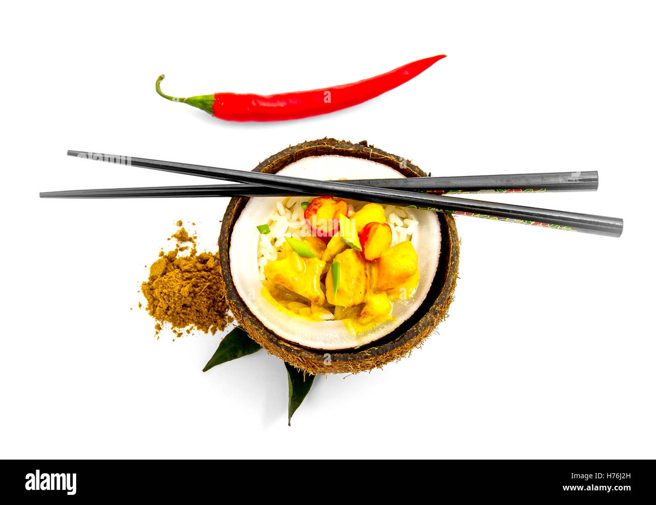 Coconut, rice and curry chicken isolated on white, top view Stock Photo