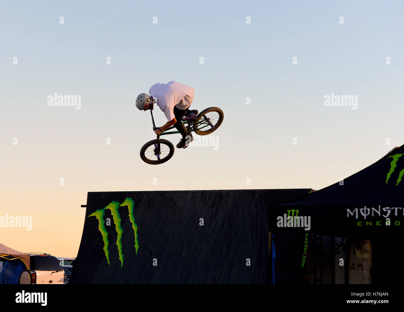 A person doing a landing a trick jump on a BMX bicycle Stock Photo