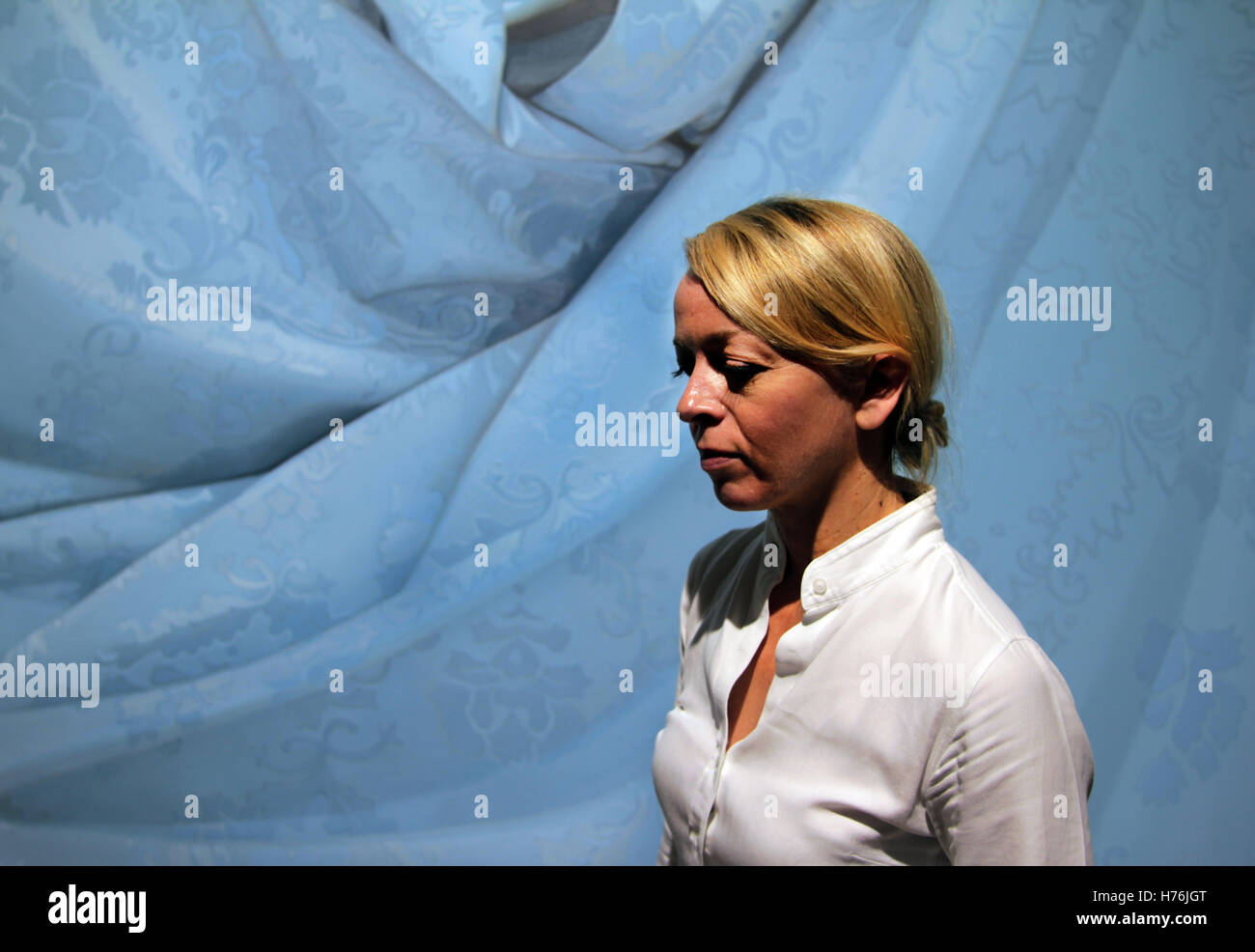 The Scottish artist, Alison Watt, in front of one of her fabric paintings. Stock Photo