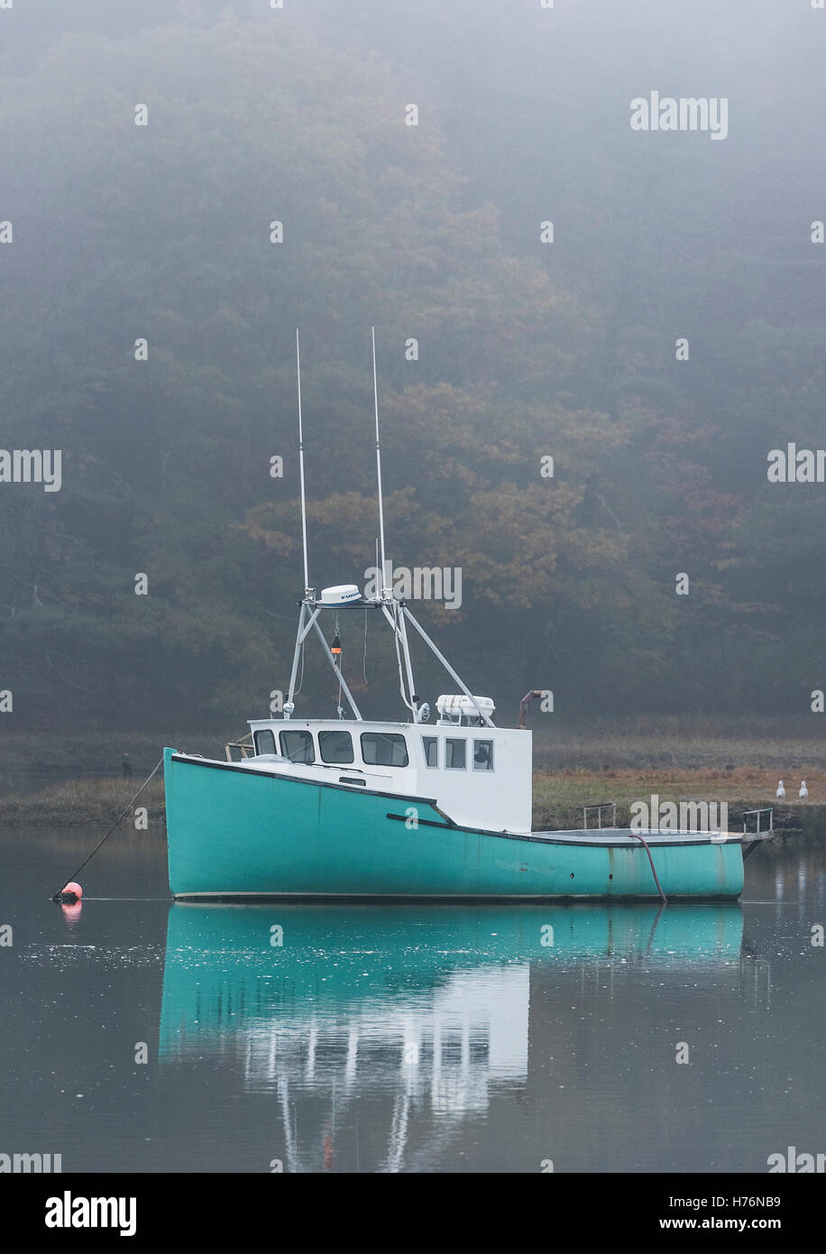 Fishing boat in morning mist, Kennebunk, Maine, USA. Stock Photo