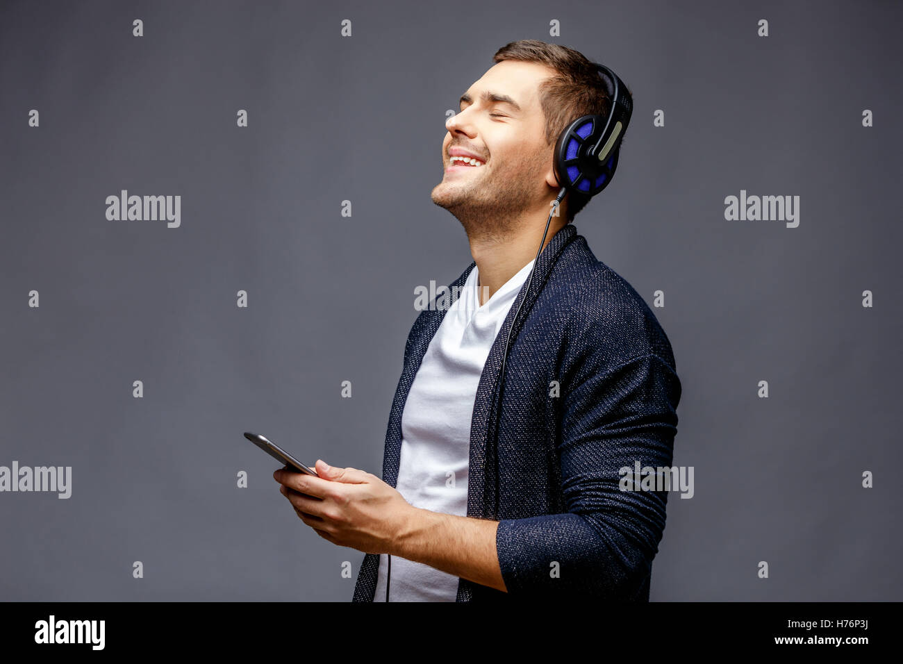 Cheerful young man in smart casual wear Stock Photo - Alamy