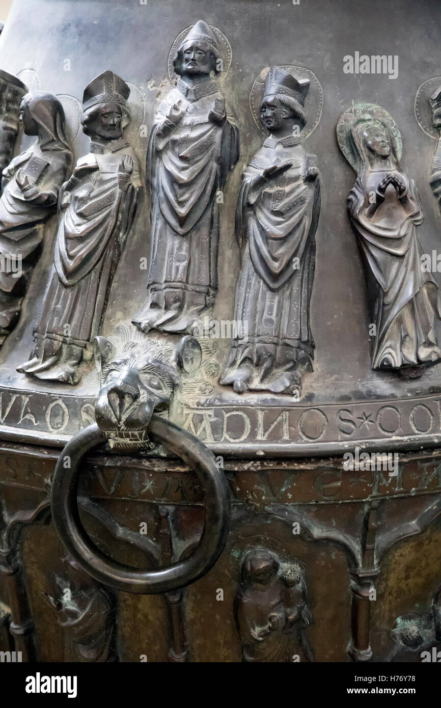 Figures on the bronze Baptismal font in St Mary's Church in Rostock, Germany Stock Photo