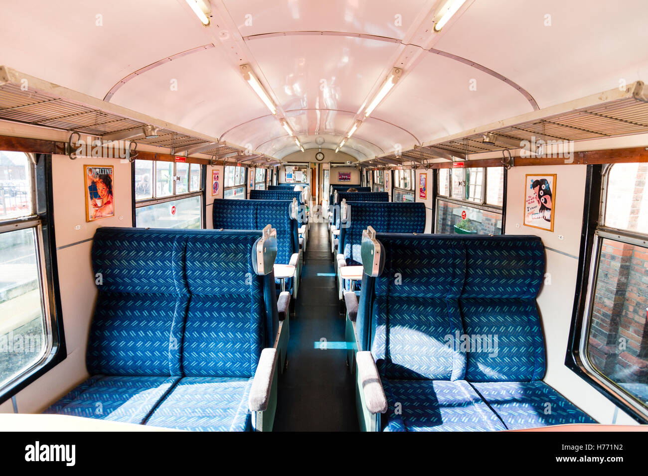 Spa Valley railway, England. British Rail Green buffet car at station. 1960 to 1970 style. Interior, blue seating with small tables. Stock Photo