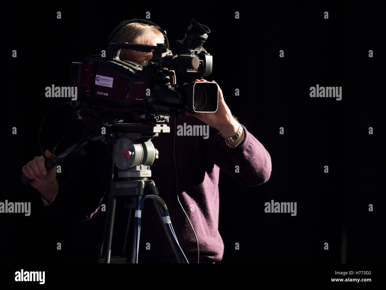A broadcast tv cameraman using his camera for television recording seen