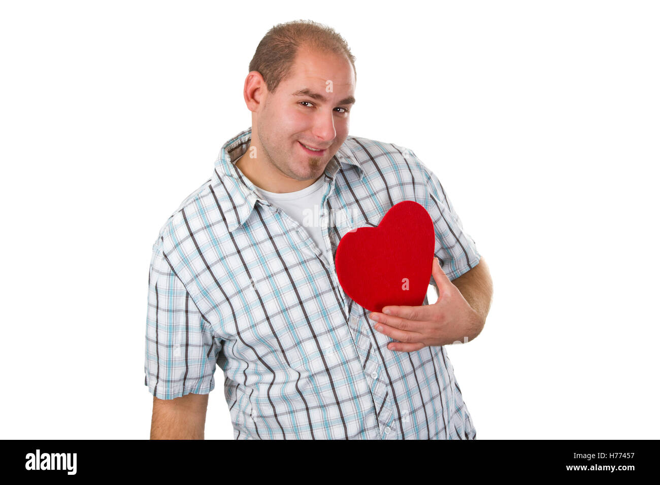 Young man holding red heart - isolated on white background Stock Photo ...