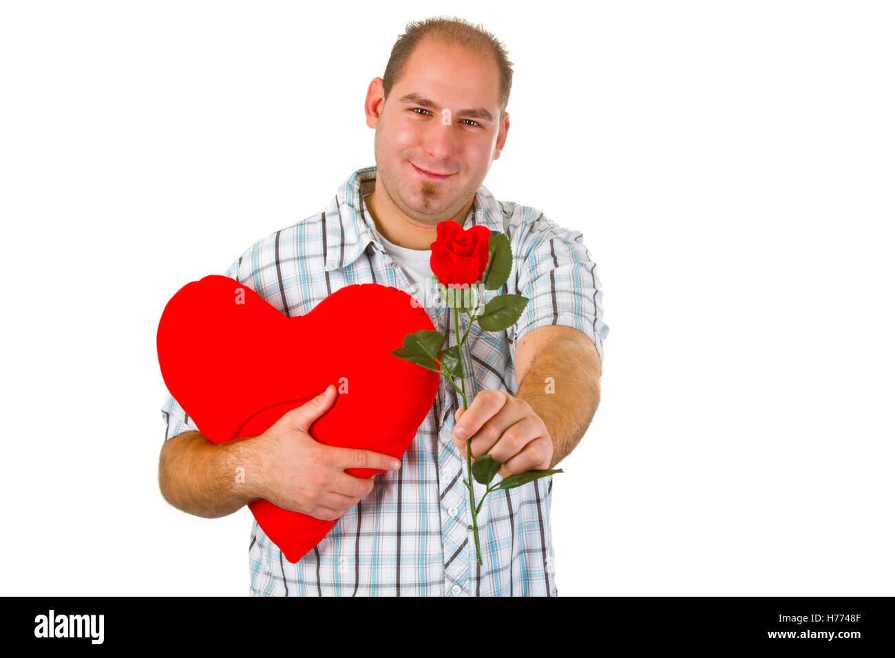 Young man holding red heart - isolated on white background Stock Photo ...