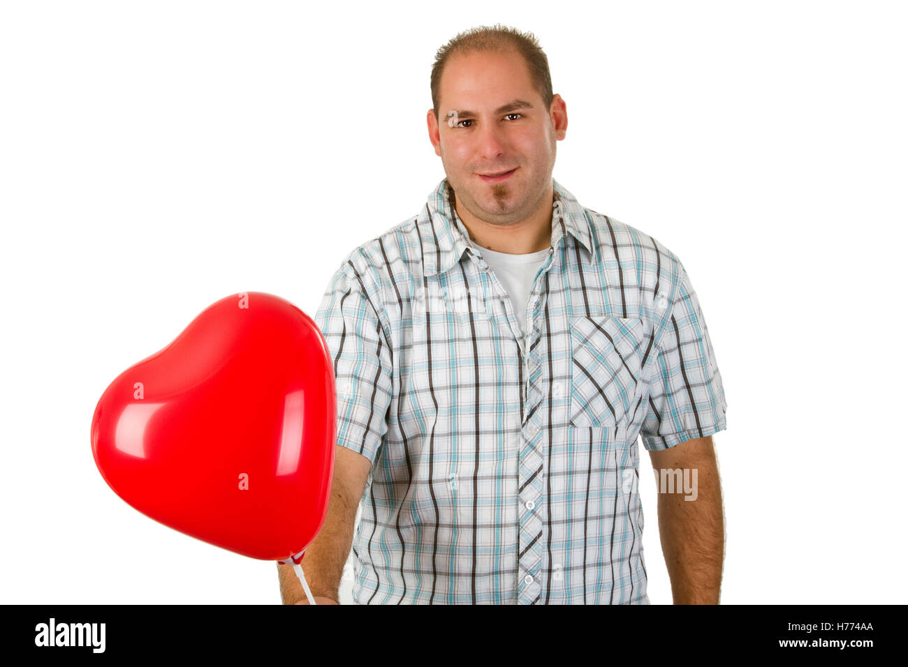 Young man holding red heart - isolated on white background Stock Photo ...