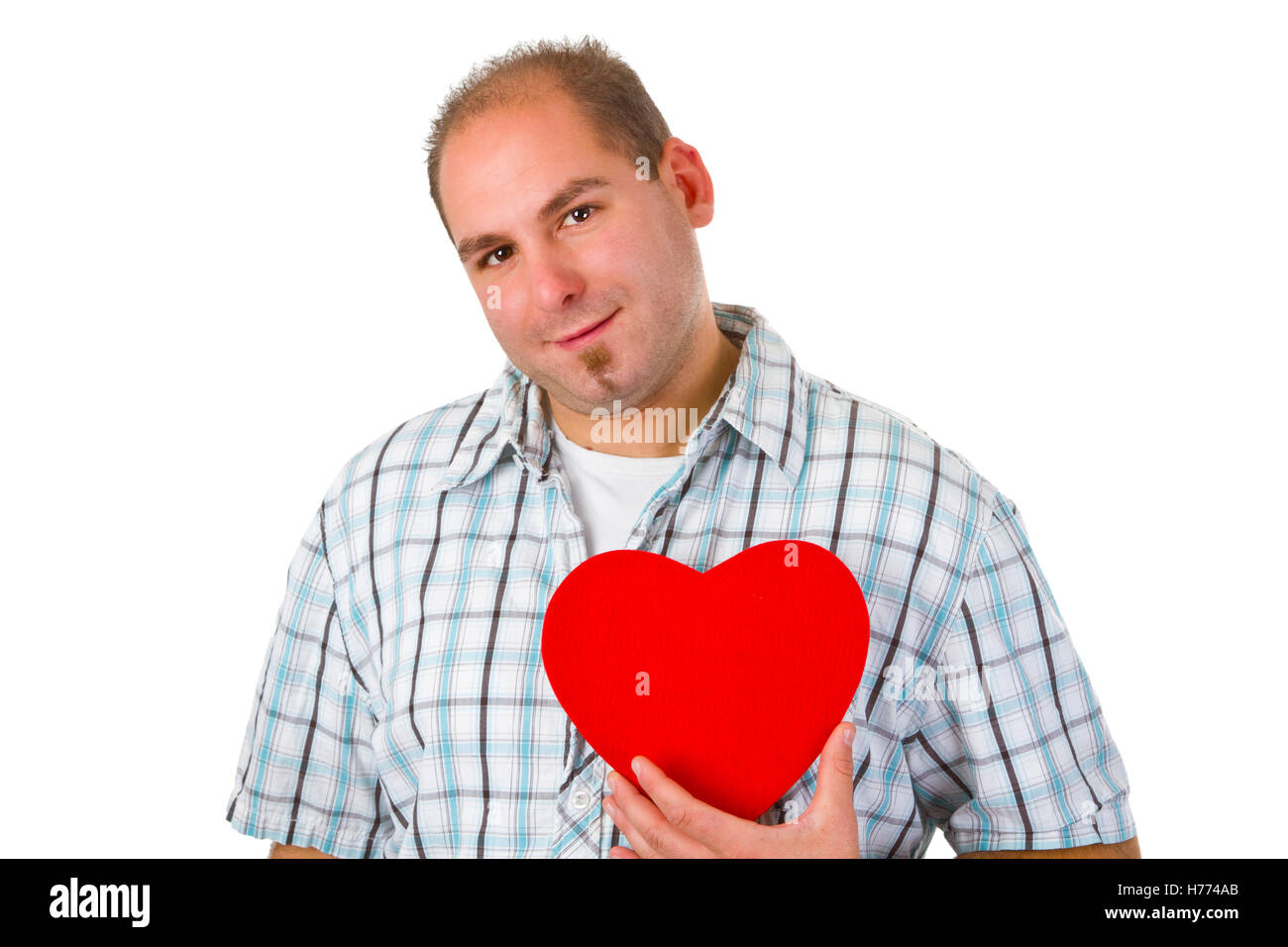 Young man holding red heart - isolated on white background Stock Photo ...