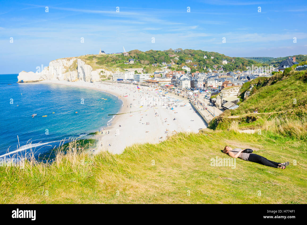 FECAMP, FRANCE - SEPTEMBER 16, 2012: Beach scene with Shore and cliffs, locals and visitors, in Fecamp, Haute-Normandie, France Stock Photo