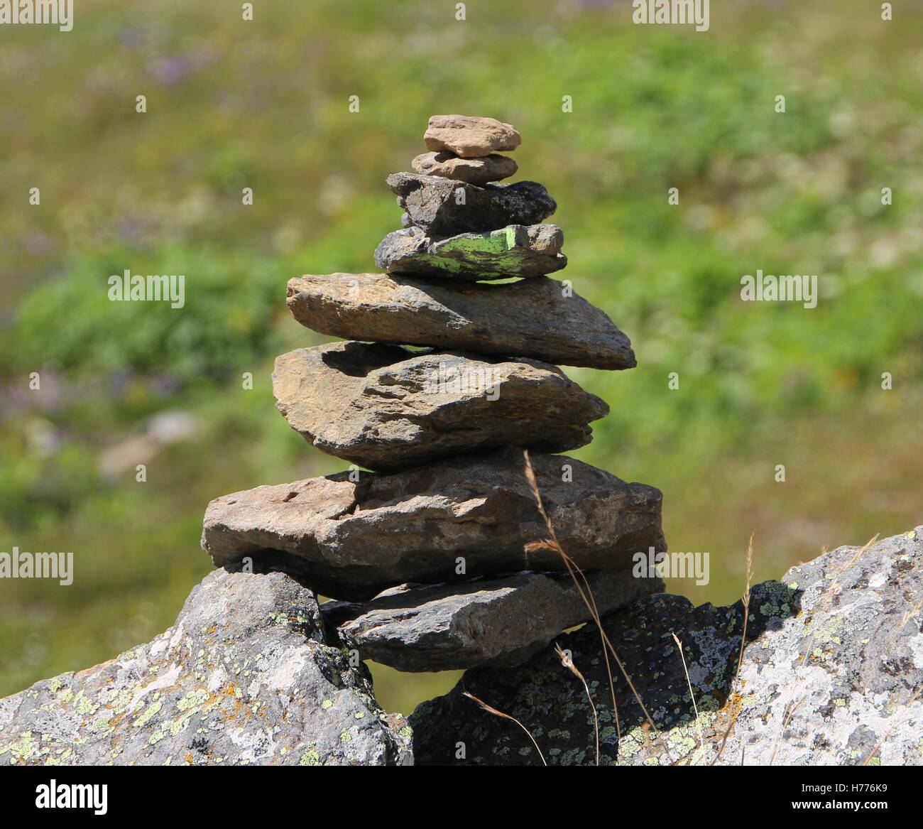 A miniature Inukshuk in the Swiss Alps Stock Photo
