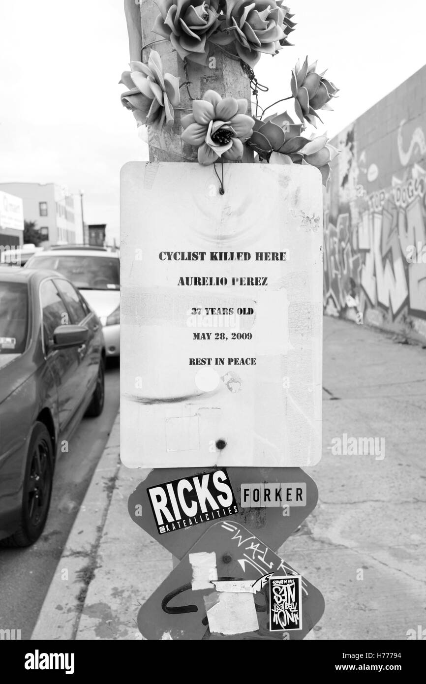 Photograph of sign stating the death of a cyclist in Brooklyn, New York, USA  A memorial for Aurello Perez, poster stating his death on light post Stock Photo