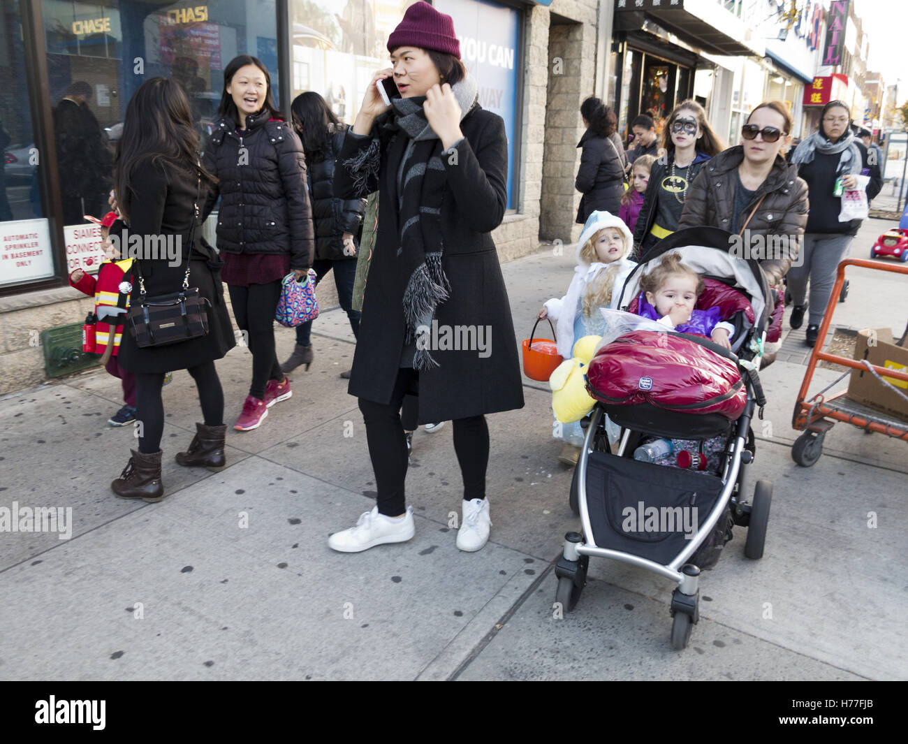 Multi-ethnic families celebrate Halloween in the Bensonhurst section of Brooklyn, New York, 2016. Stock Photo