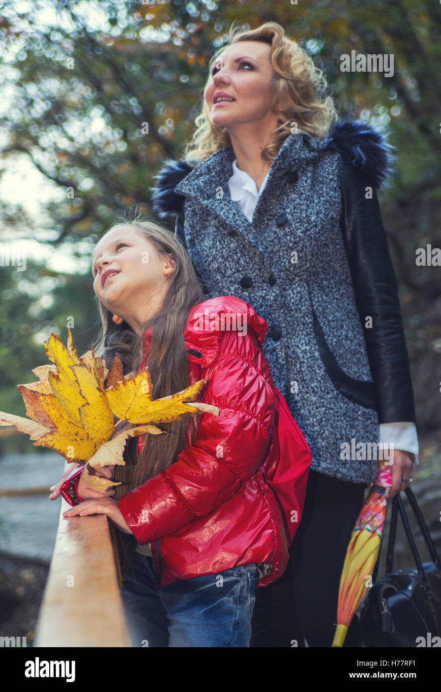 mother and daughter in the autumn park Stock Photo - Alamy