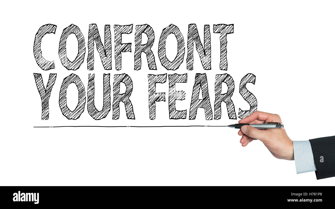 confront your fears written by hand, hand writing on transparent board, photo Stock Photo