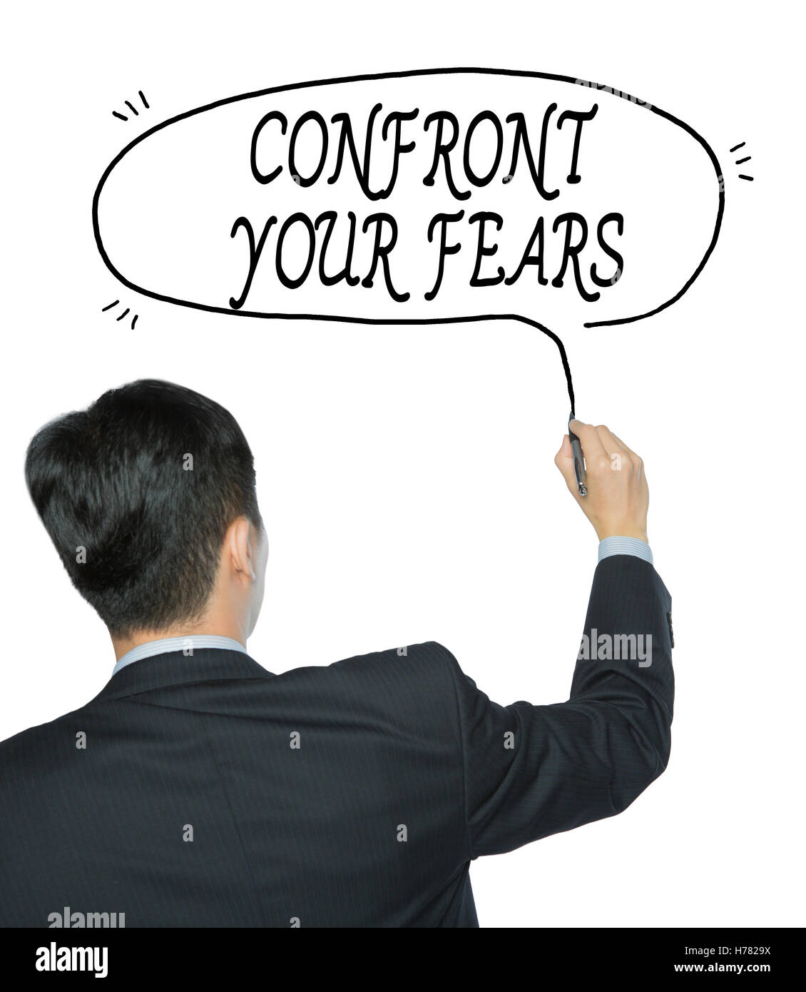 confront your fears written by businessman in black suit, hand writing on transparent board, photo Stock Photo