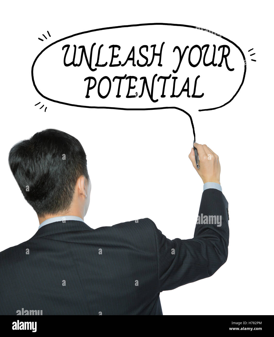 unleash your potential  written by businessman in black suit, hand writing on transparent board, photo Stock Photo