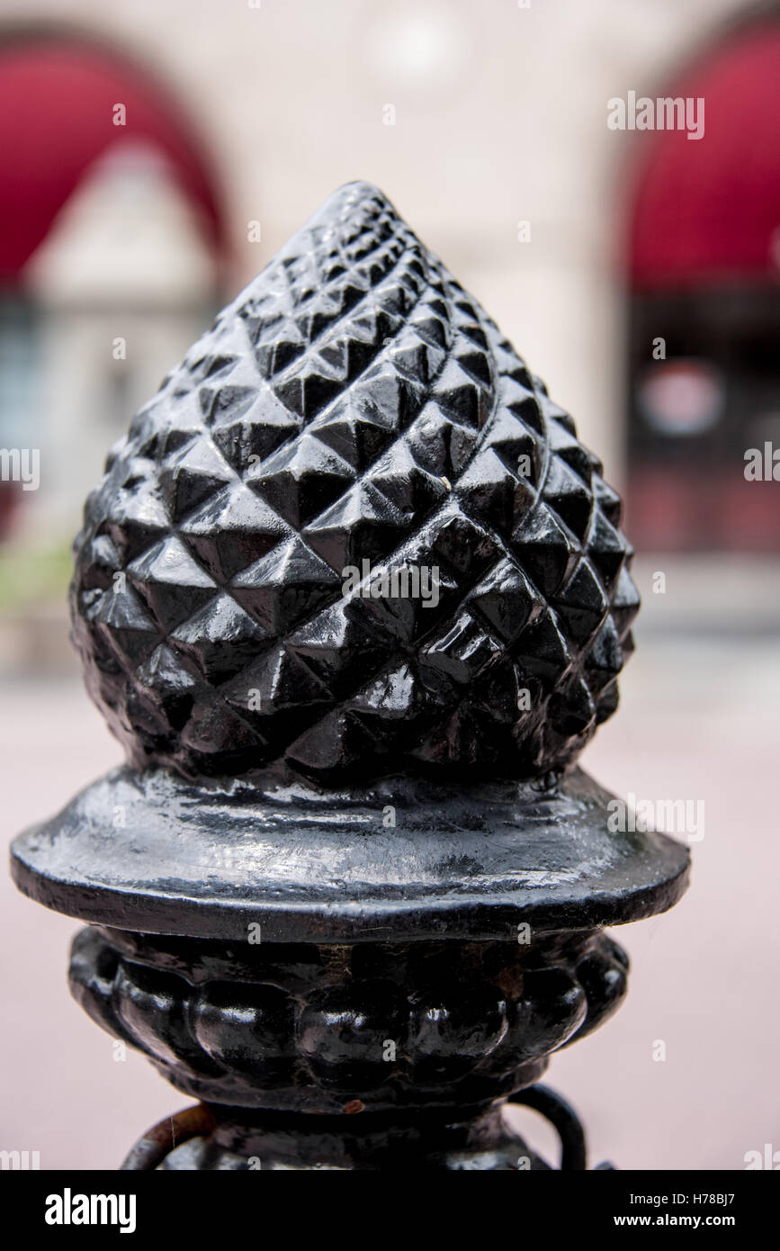 Brass pineapple finial on old colonial architecture on an outdoor