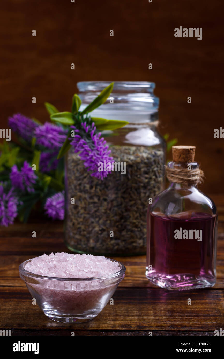 Spa setting and health care items, lavender handmade soap,body oil,bath salt, towel, on wooden board Stock Photo
