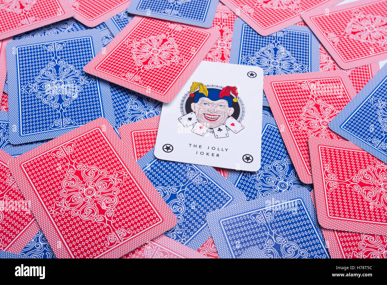 joker card among some playing cards Stock Photo
