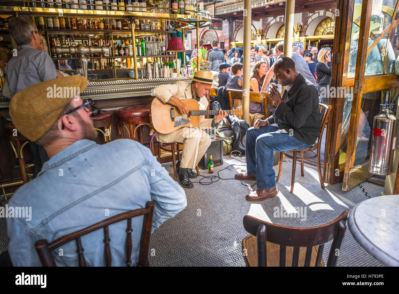 Soho London bar cafe summer, view of a pair of blues musicians performing inside the Cafe Boheme in Old Compton Street, Soho, London, England, UK. Stock Photo