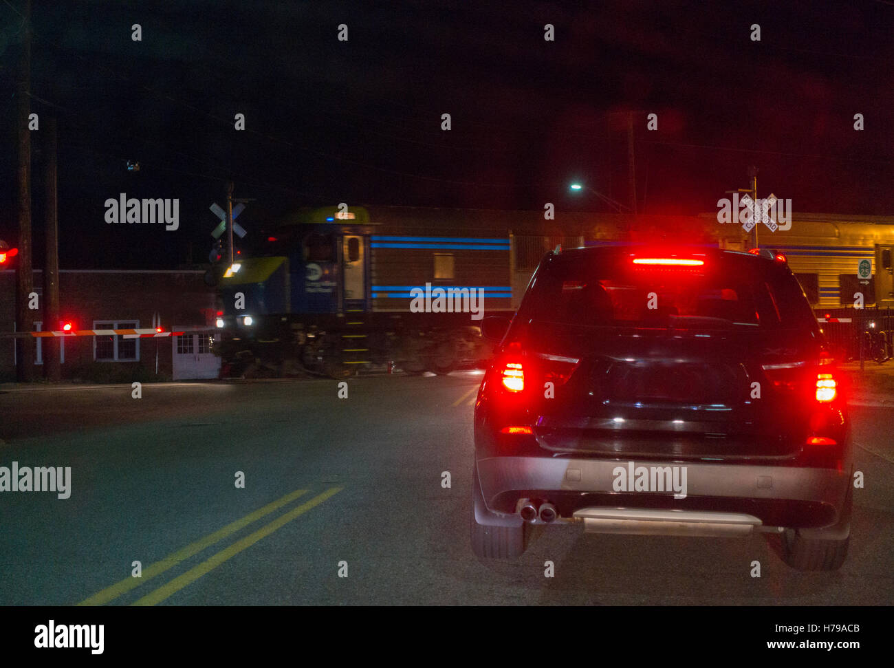 commuter train passing in front of a car Long Island NY Stock Photo Alamy