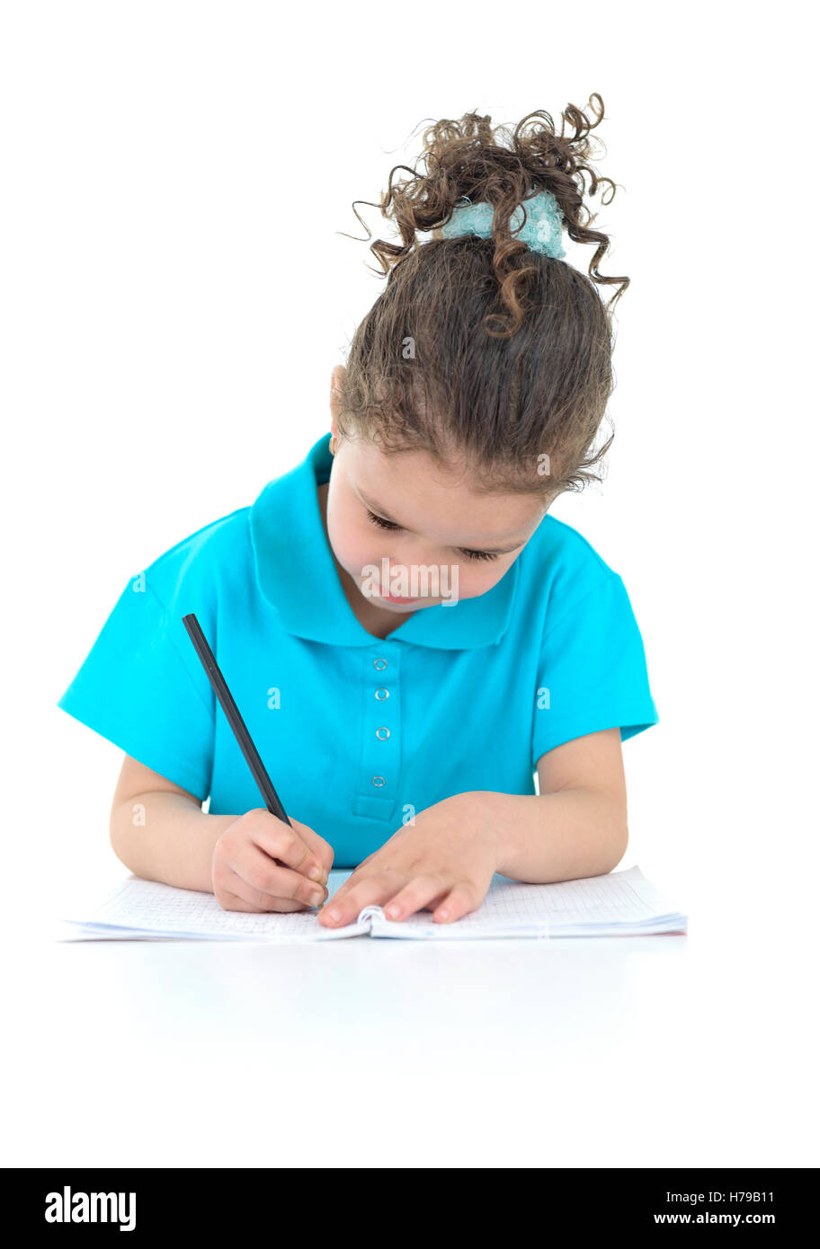 Little Girl Doing Her Homework Isolated on White Background Stock Photo