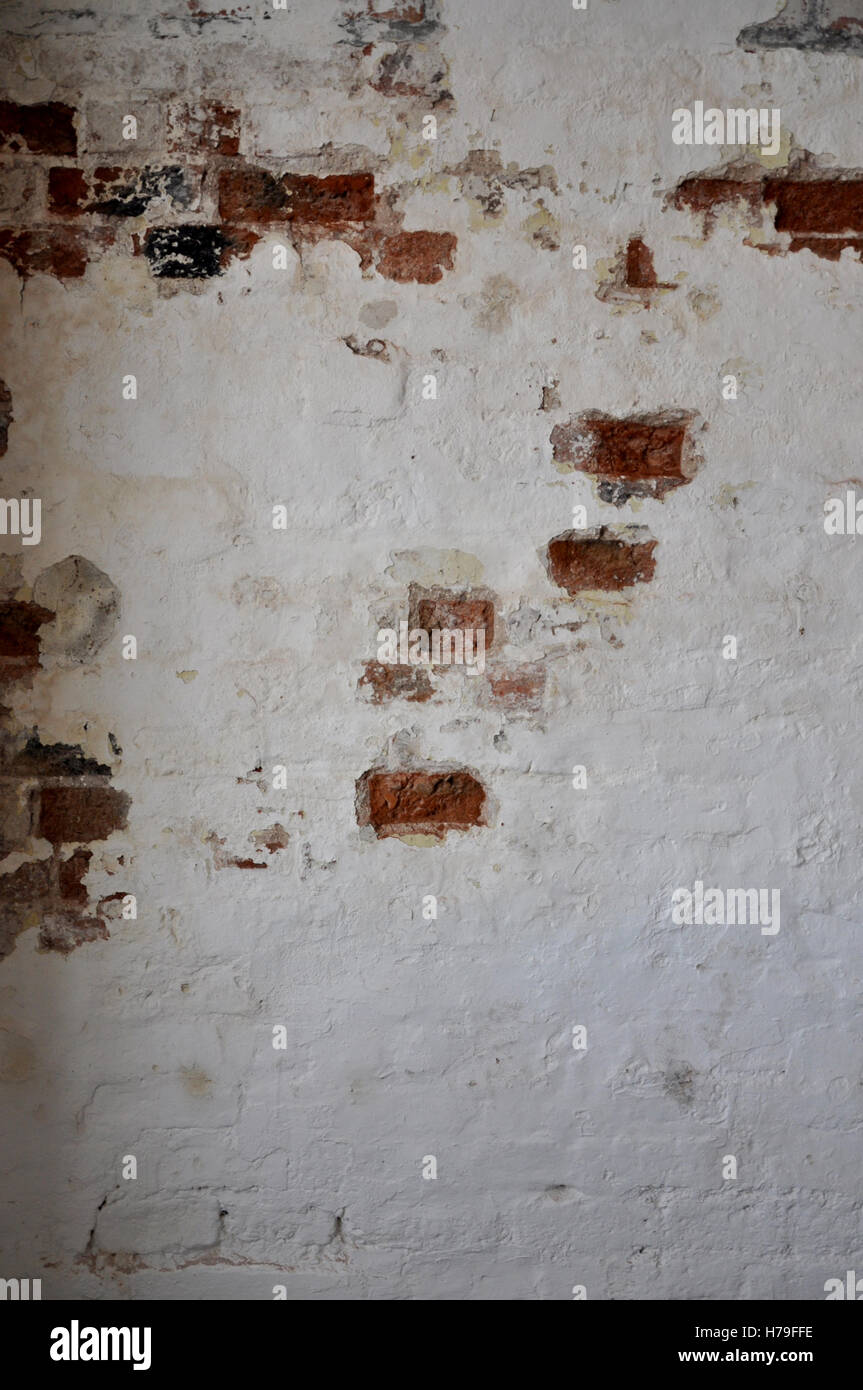 Rustic, painted brick wall with peeling paint Stock Photo Alamy