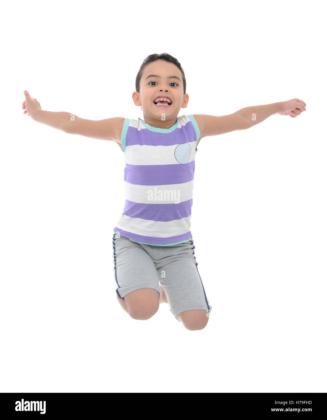 Active Young Boy Jumping With Joy Isolated on White Background Stock Photo