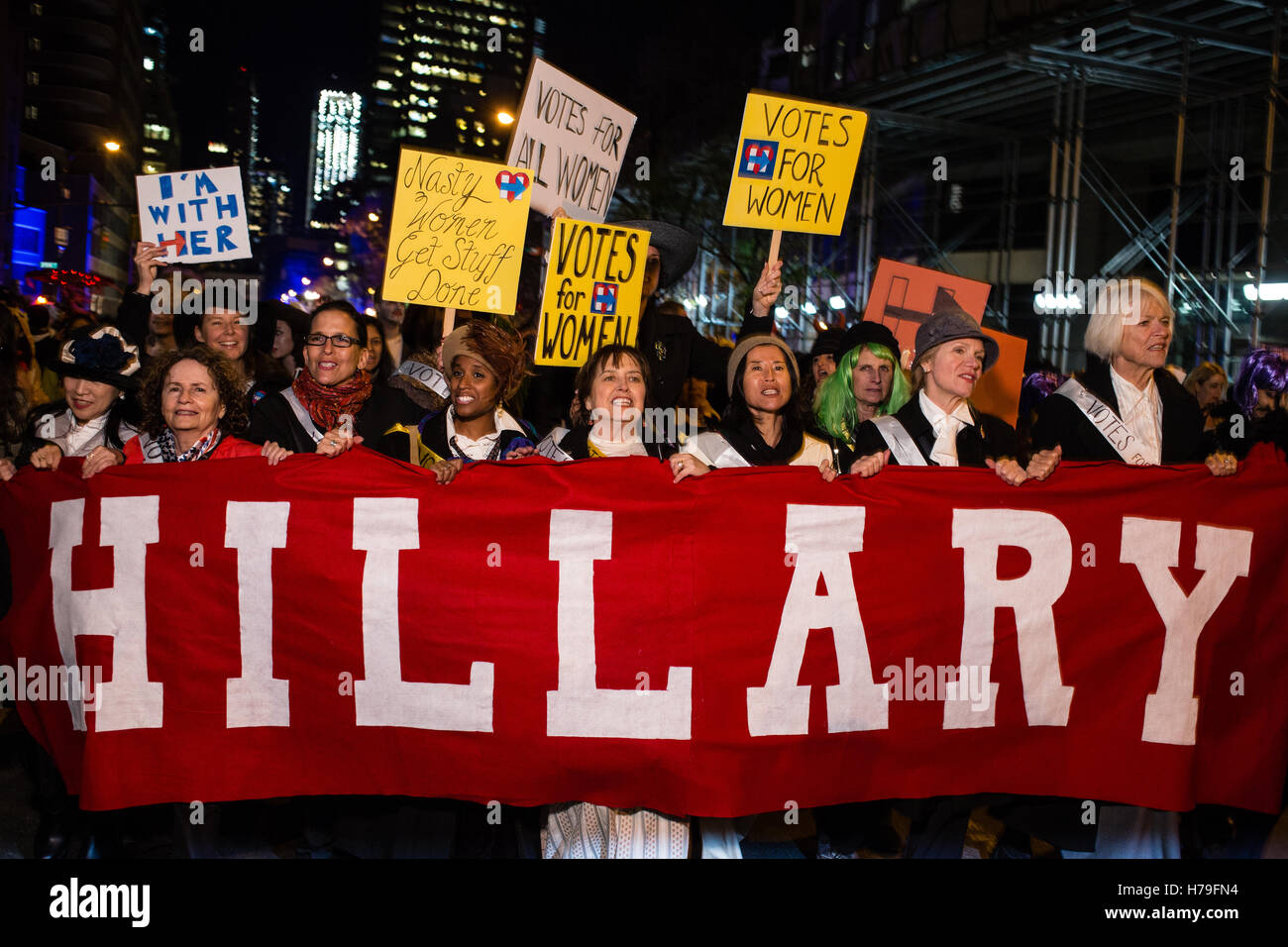 New York, NY - 31 October 2016. Marchers in support of Hillary Clinton marrch behind a banner that simply reads 'Hillary' in the Stock Photo