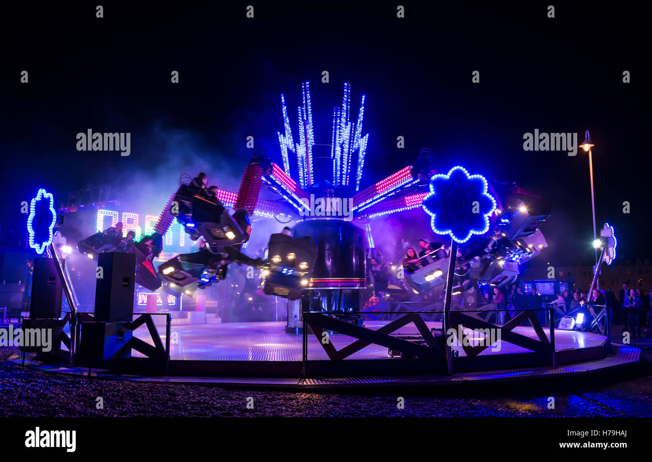 Orbiter funfair ride at night and an outdoor event. Stock Photo