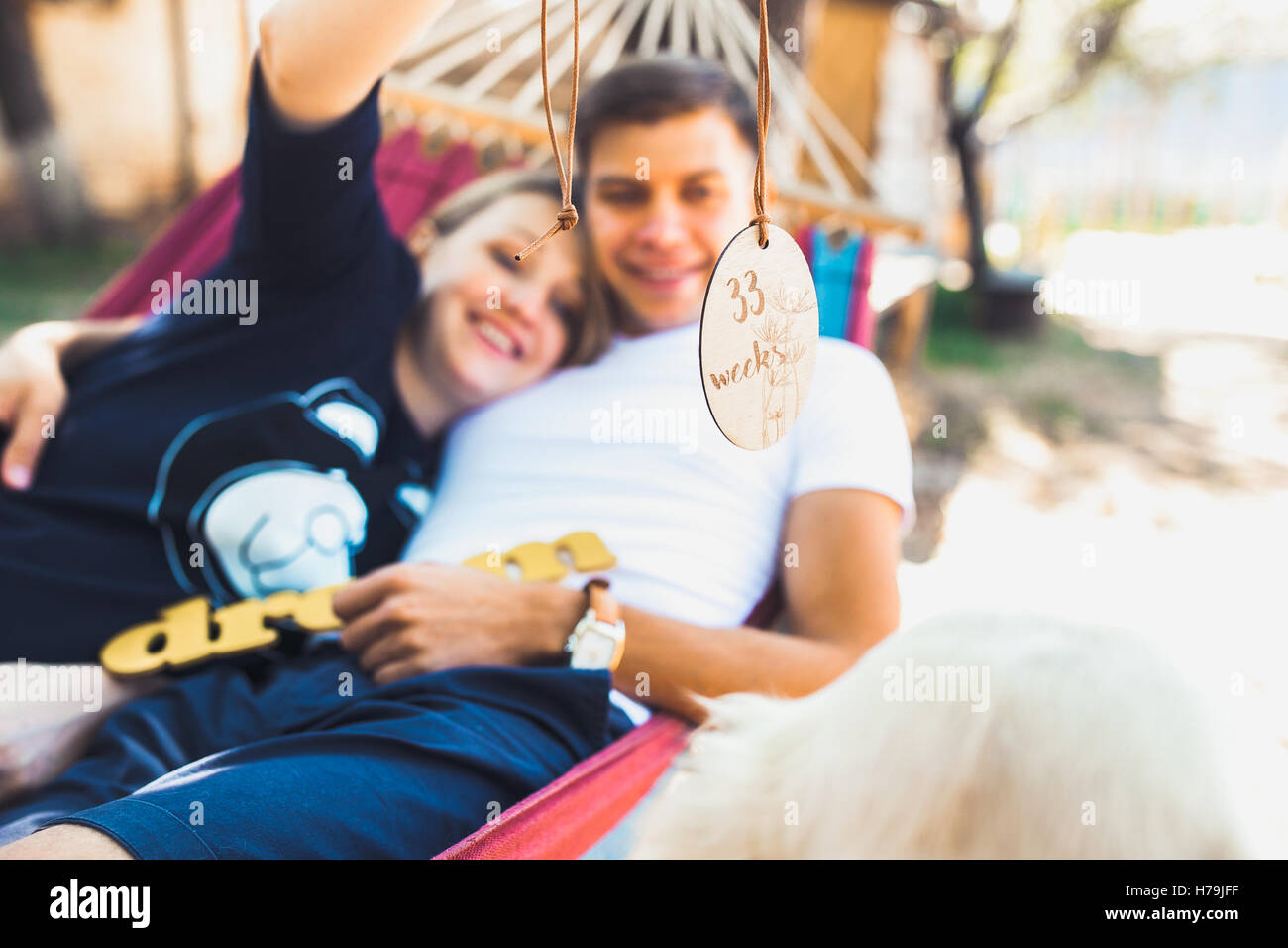 Pregnant woman and husband, resting in a hammock Stock Photo Alamy