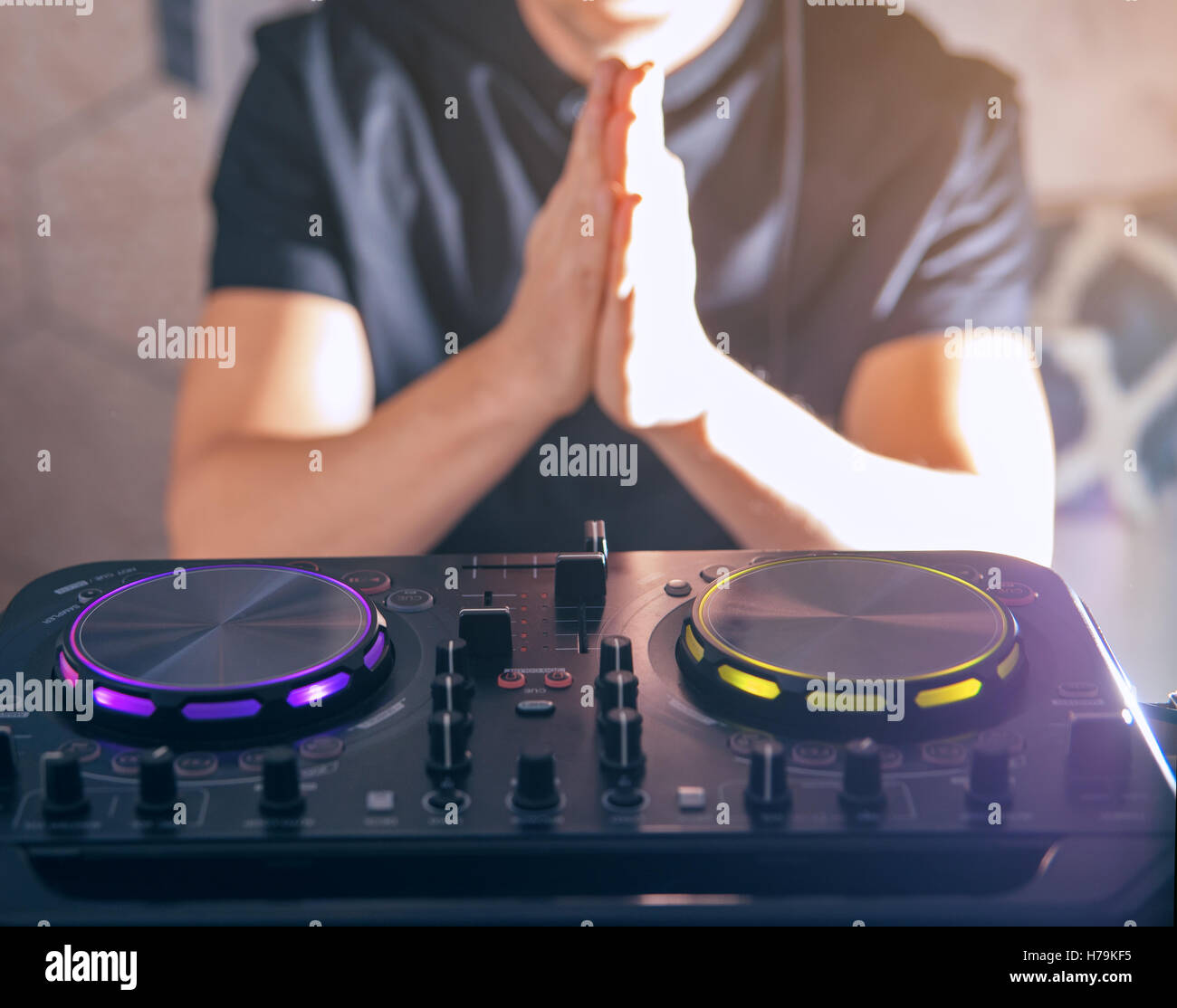DJ turntable console mixer controlling Stock Photo Alamy