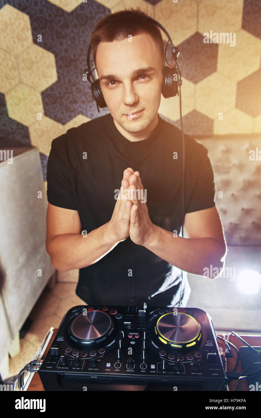 Young man DJ with mixer is working Stock Photo Alamy