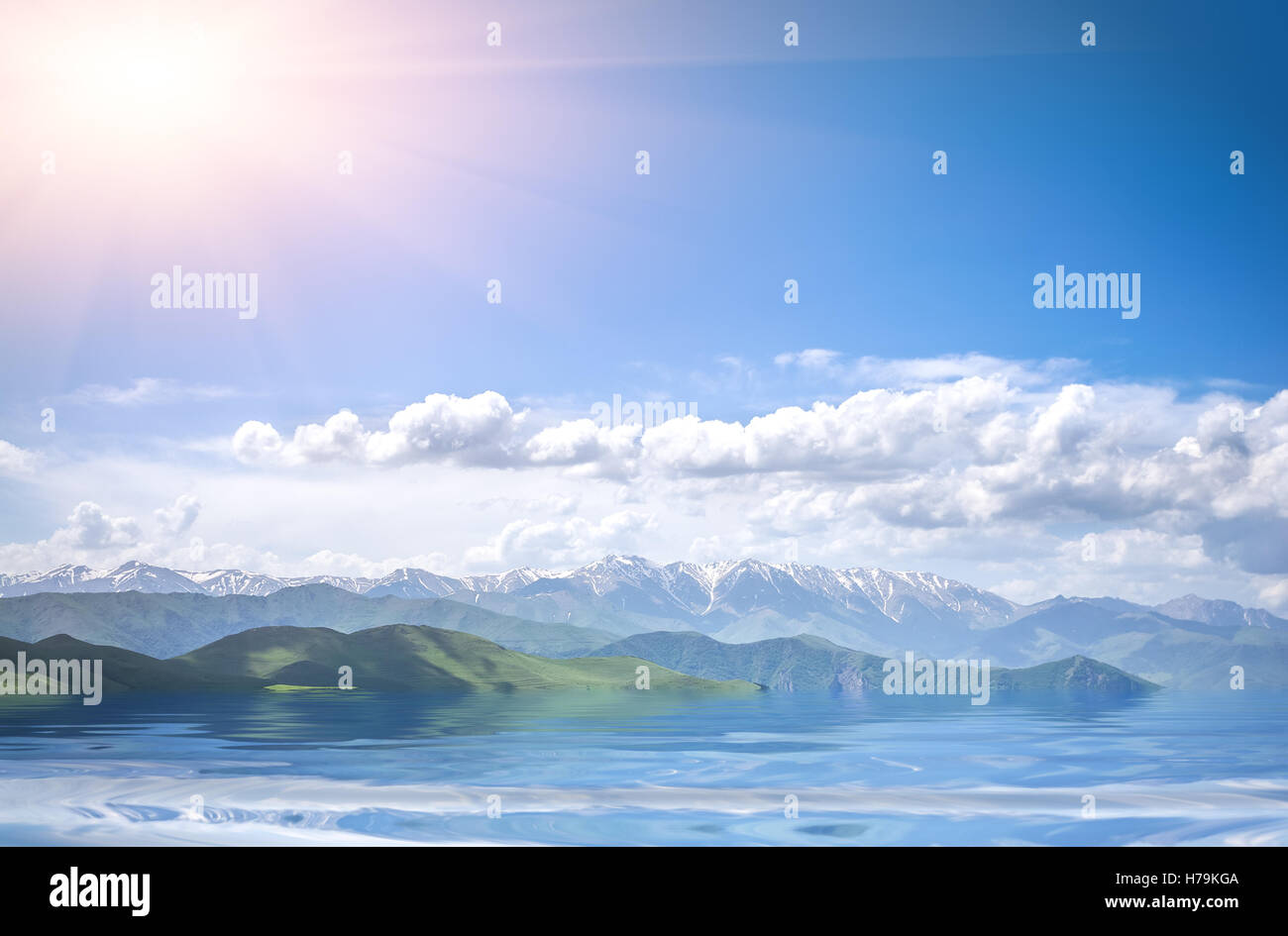 mountains, sea and cloudy blue sky Stock Photo - Alamy
