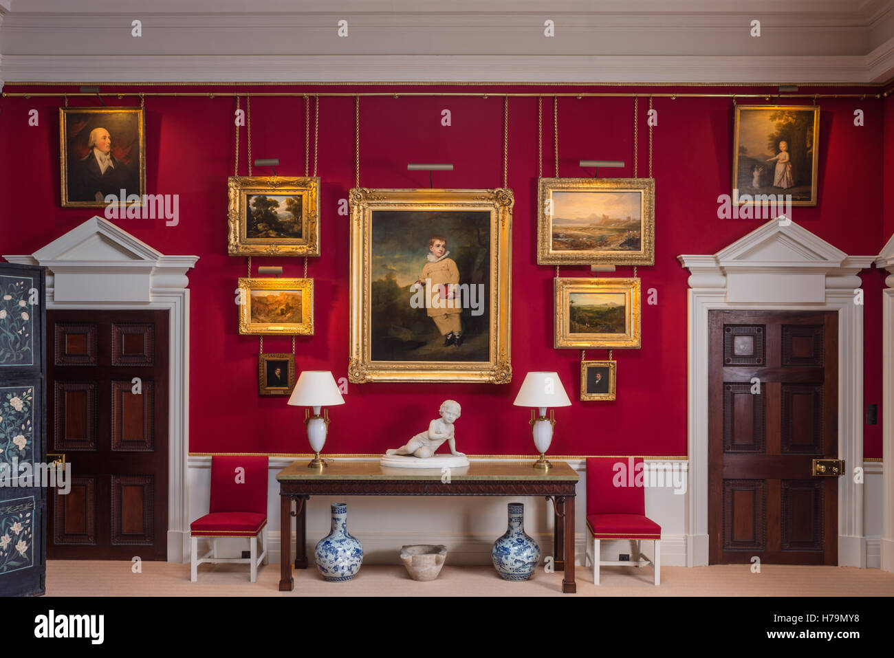 Red dining room in palladian 18th century Dumfries house, Ayrshire, Scotland Stock Photo