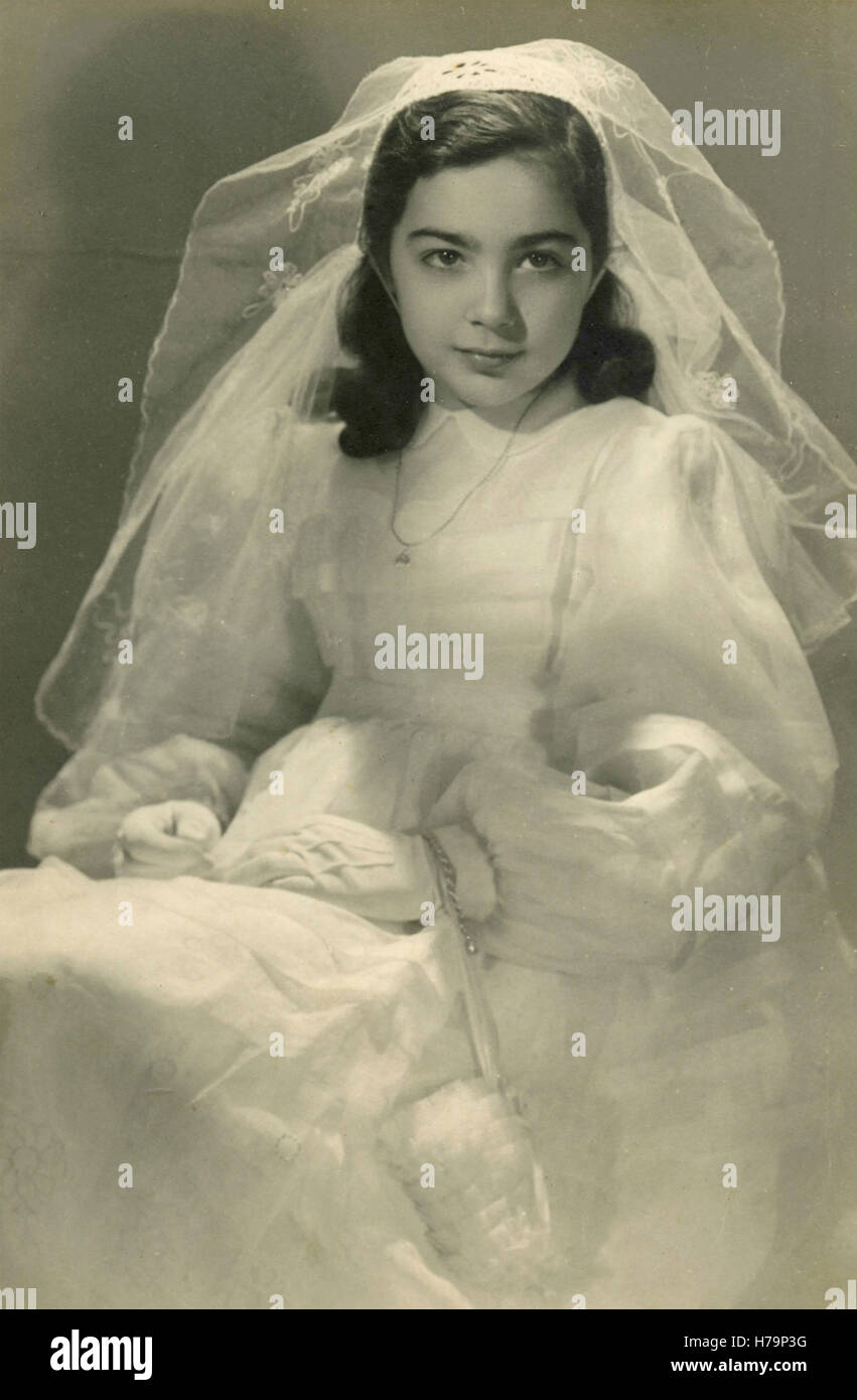 Young girl dressed up for her first communion, Italy Stock Photo - Alamy