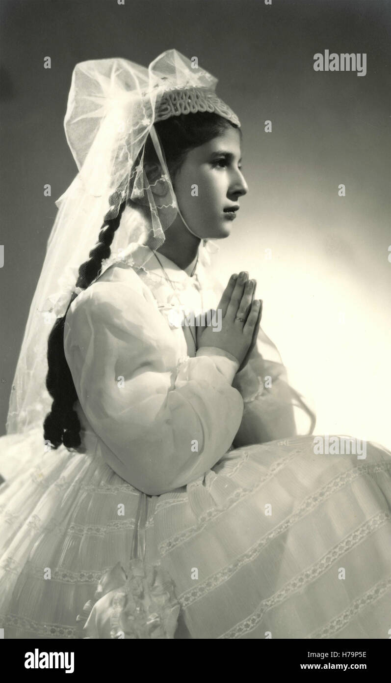 Young girl dressed up for her first communion, Italy Stock Photo - Alamy