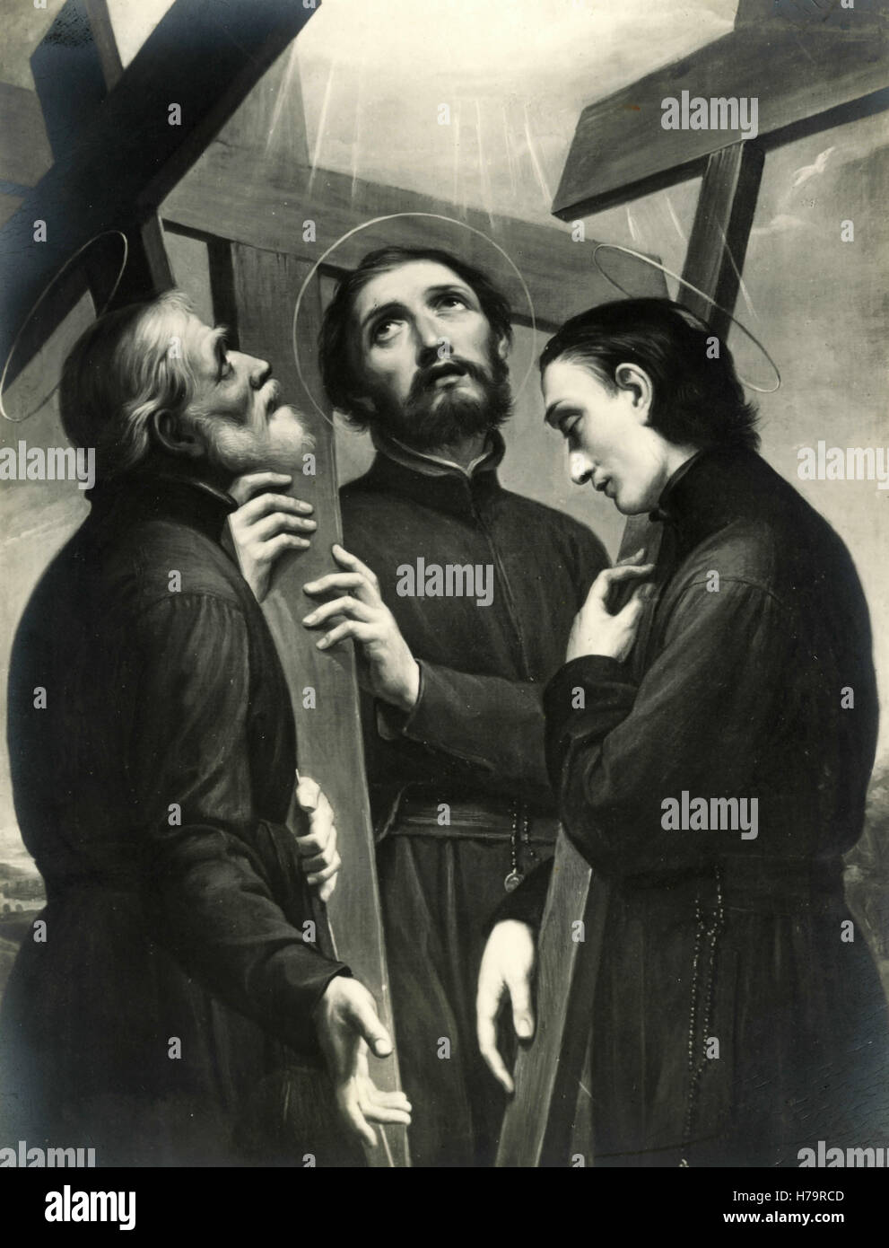 Three priests with three crosses Stock Photo