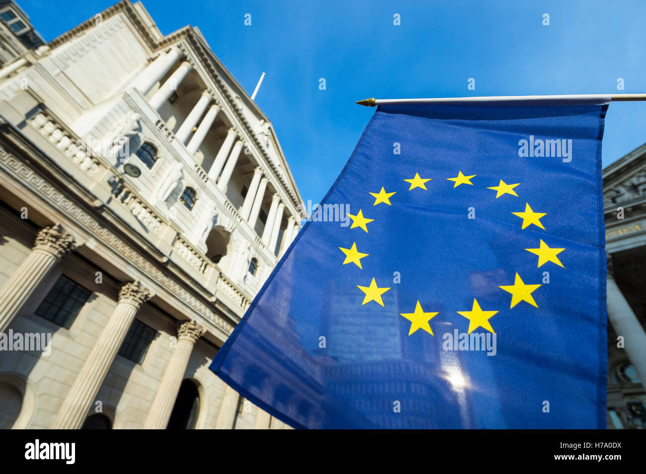 European Union flag flying in front of the Bank of England as a symbol of the financial repercussions of Brexit EU referendum Stock Photo